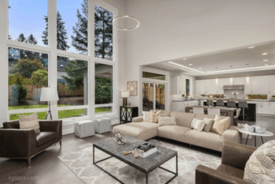 Open concept living room with sweeping floor to ceiling windows
