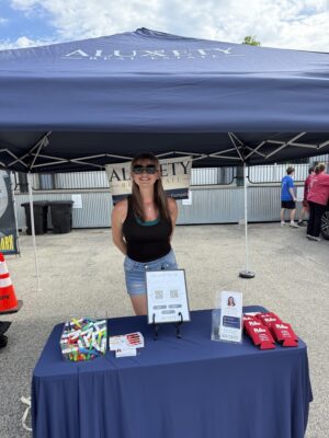 Realtor Nicole Sargent hosting Aluxety table at Block Party, Amesbury Days 2026